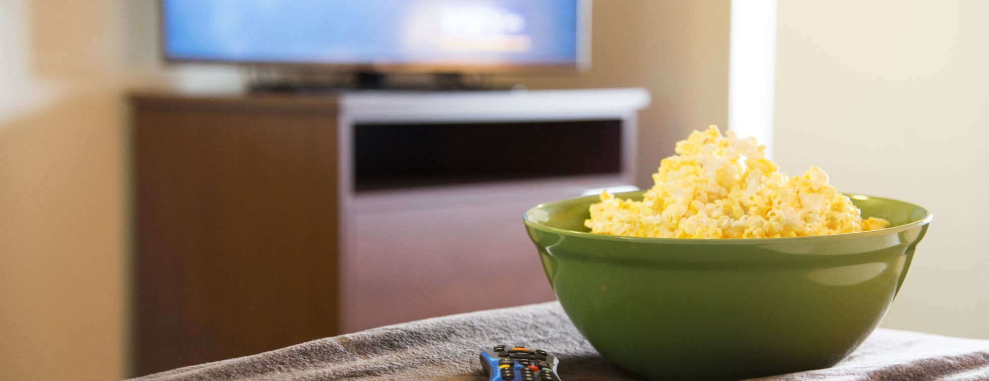 Popcorn and a movie in a hotel room 
